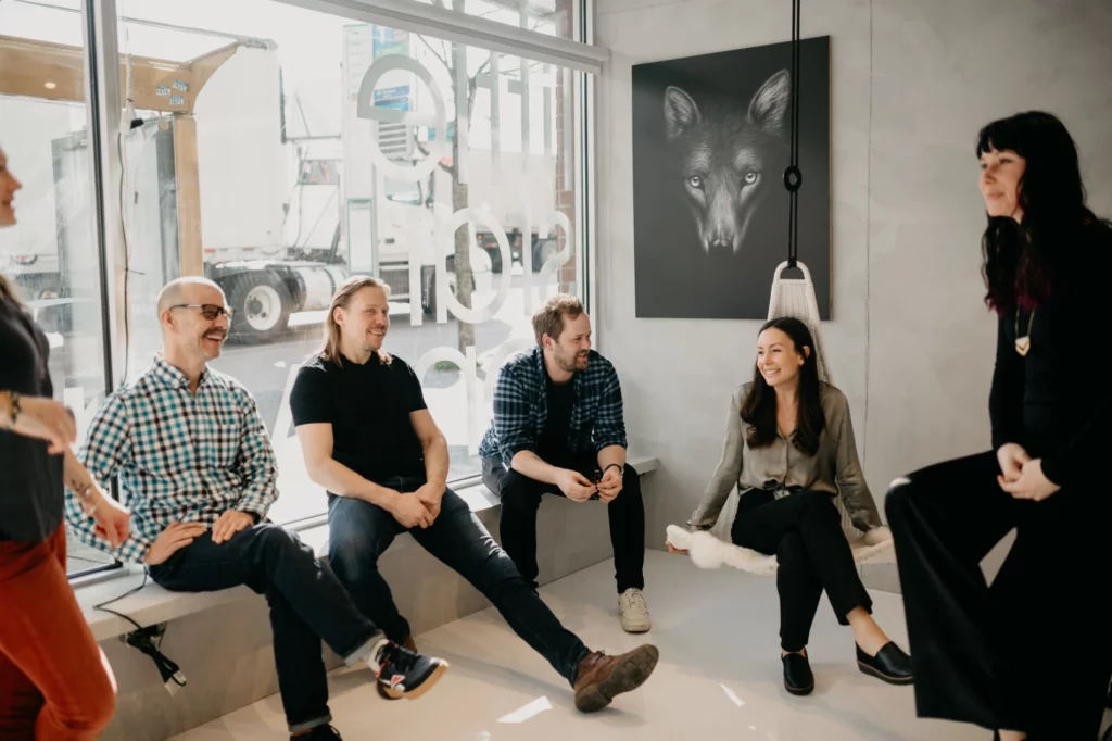 Little Star team laughing together in the office